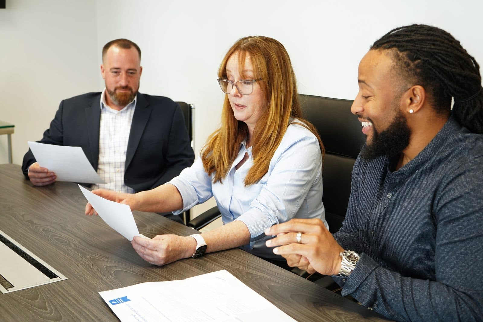 The Road Ready Insurance team reviewing a policy together